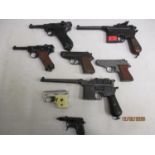 A quantity of replica guns to include a spud gun
