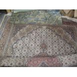 A large Indo-Persian carpet having multiguard borders and geometric designs, together with a wall