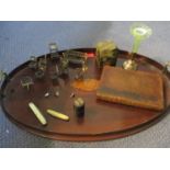 An Edwardian mahogany galleried and twin handled tray with central shell motif, together with