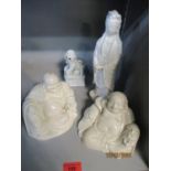 Four blanc de chine figures and models to include two Buddhas