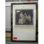 An early 20th century signed photograph of the Sultan and family, mounted and glazed in a Japanned