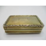 A George IV silver gilt snuff box, Birmingham 1827, by Thomas Newbold, of rectangular form, with