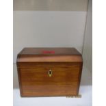 An early 20th century walnut tea caddy