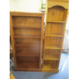 A modern yew wood five tier bookcase 60"h x 28 1/2"w, together with a pine bookcase 70"h x 17 3/4"w