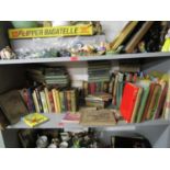 A shelf of mainly children's books and annuals to include T S Eliot's Old Possum's Book of Practical