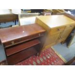A reproduction mahogany magazine rack with drawer under, together with a light oak sideboard and a