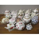 A quantity of Victoria & Albert Museum miniature collectors teapots and others
