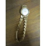 A Regency gold cased ladies wristwatch on a 9ct gold bracelet