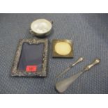 A quantity of silver items to include two photo frames, total weight, 646g