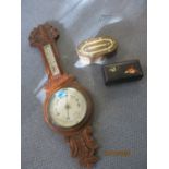 An early 20th century British carved oak wall barometer, and two boxes to include a black