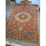 A red ground Persian rug having a central motif and multiguard borders 74" x 52"