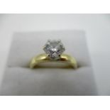 An 18ct yellow gold diamond solitaire ring, raised six claw setting, maker EMF, approx 0.6ct, size