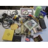 A mixed lot to include a Donald Duck puppet, WWII headphones, cased scientific instruments and other