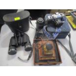 Photographic related items to include a Praktica MTL 50 35mm camera, a Pentacon and other lenses and