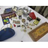 Small lead figures and counters, dolls house furniture, costume jewellery and miniature perfumes,