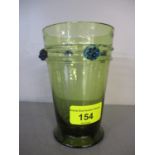 Circa 1900s a green glass tumbler decorated with blue strawberries, possibly Venetian