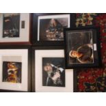 Five signed photographs with original and facsimile autographs, framed, to include John Travolta,