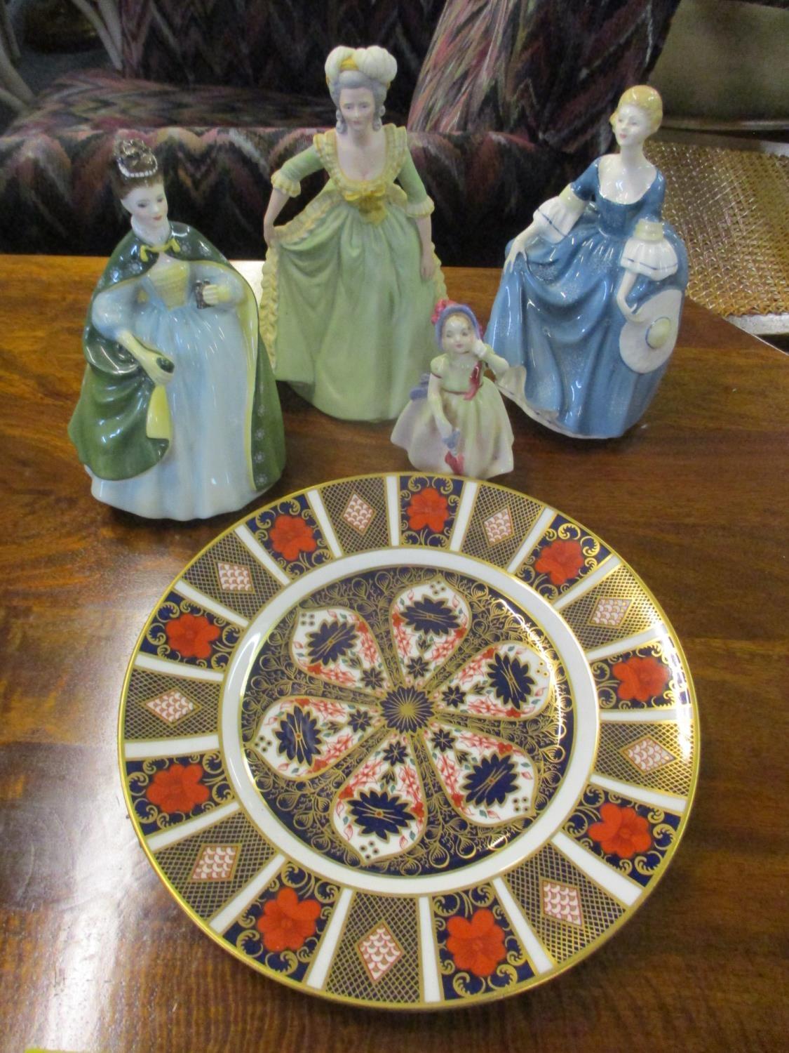 A mixed lot of ceramics to include three Royal Doulton figures, a Franklin porcelain figure of Marie