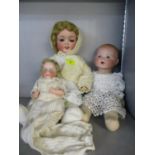 Three bisque headed dolls to include an Armand Marseilles Dream Baby with a cloth body