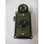 A black cased Coronet midget camera in a black leather case