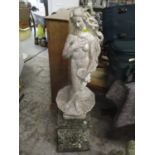 A garden stoneware statue of a nude female on a raised plinth, 49 3/4"h