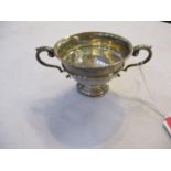 A silver twin handled pedestal bowl 124.2g. Location: CAB