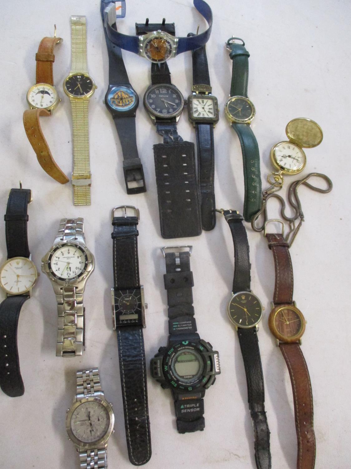 A quantity of wrist watches to include a Swatch Watch and a gents Citizen watch and a small quantity