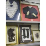 Five framed items of vintage clothing comprising a pair of 1920s ladies black crocheted evening