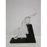 Designed by Rosetta for Baccarat - Panther The Leap, a crystal glass animal ornament on a black