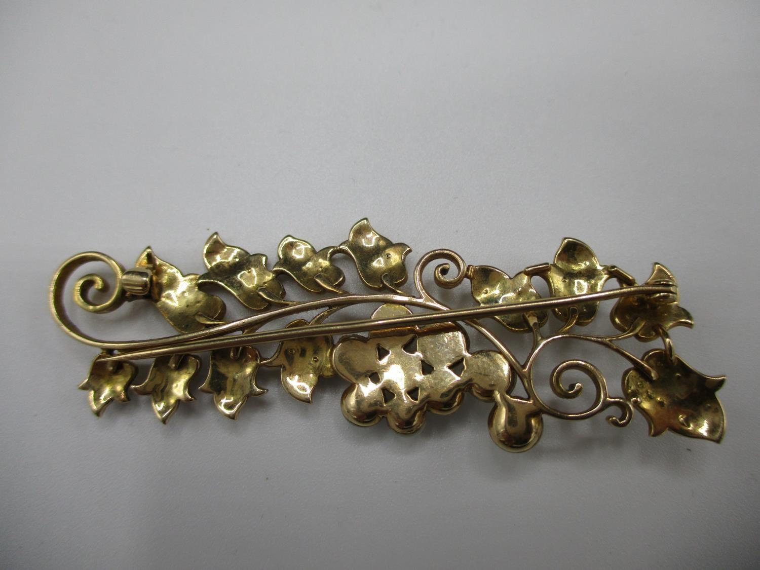A gold coloured metal brooch fashioned as a fruiting vine with a scrolled stem, the fruit and leaves - Image 5 of 6