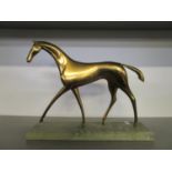 Attributed to Karl Hagenauer - an Art Deco patinated brass model of a horse raised on a green