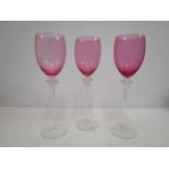 Gianni Versace for Rosenthal - a set of three Medusa wine glasses with pink tinted bowls, 11 1/2"h