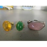 A 14ct gold and jade ring, a gold and citreen ring and a silver and pink quartz ring