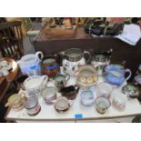 A collection of early 19th century and later copper and silver lustre jugs, commemorative mugs and