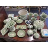 A quantity of Wedgwood green Jasperware ornaments to include a planter and a teapot