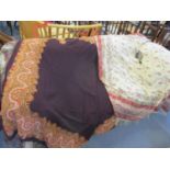 Two early to mid 20th century table shawls with woollen tassels, one having a brown ground with