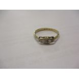 A 9ct gold and three diamond ring
