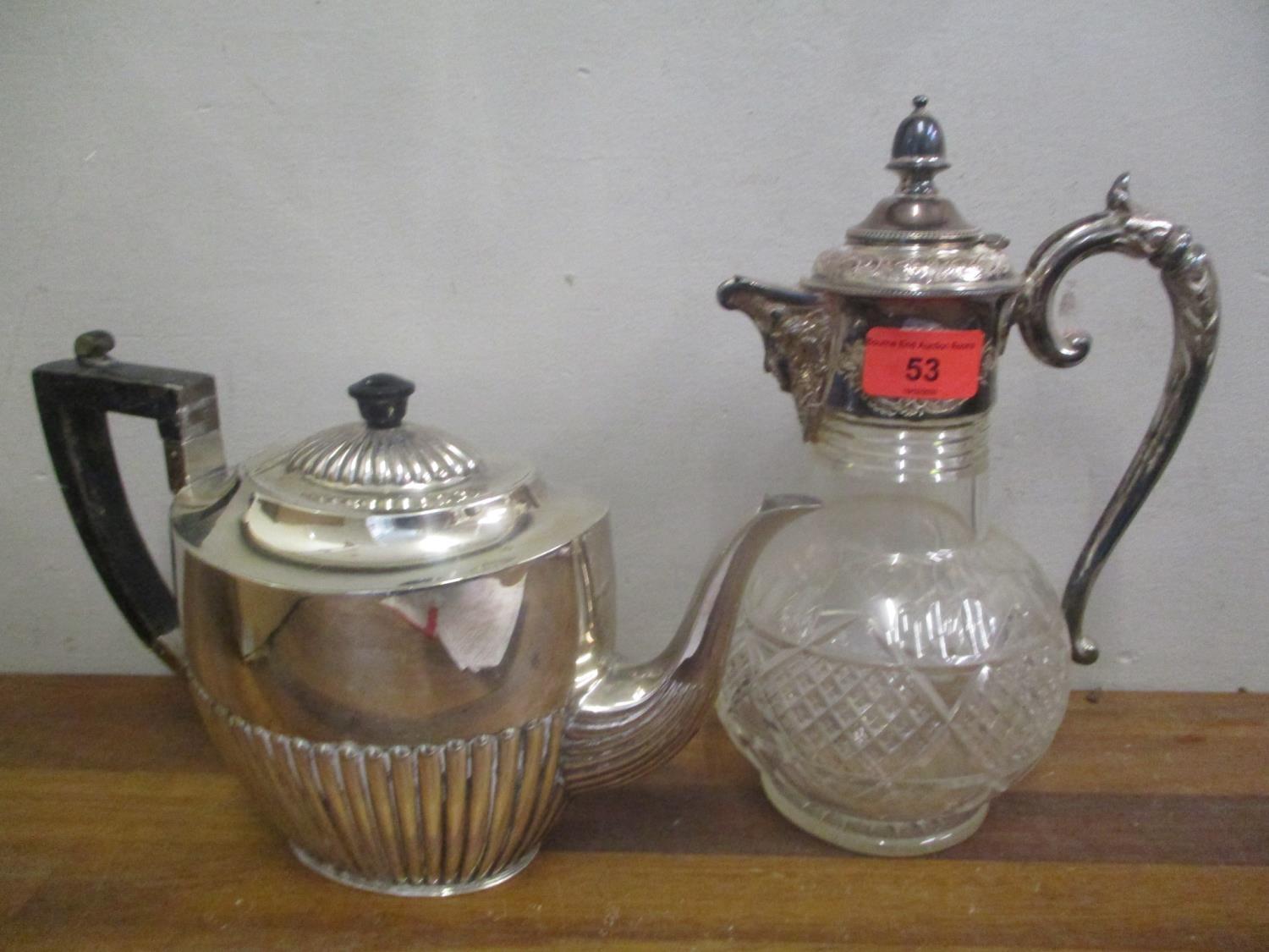 A cut glass and silver plated claret jug, together with a silver plated teapot Location: 2:1