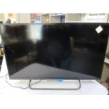 A Sony flatscreen television with 32" screen and remote