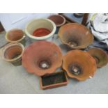 A quantity of outdoor pots and planters to include terracotta examples