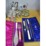 Silver plate to include a pair of fish servers, a carving set, a Walker & Hall four piece tea set,