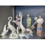 Two Lladro figures of Japanese ladies, a pair of bisque Nao models of geese, four other models of