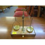 A Victorian walnut and brass scales with base drawer containing weights