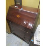 An Edwardian mahogany bureau having a fall flap above three drawers, 39" h x 29 1/2"w