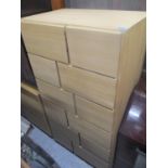 A modern light oak chest of drawers, 58" h x 31" w, together with a matching sideboard, 30" h x 53"w