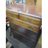 A modern American mahogany finished chest of drawers on two short and five graduated drawers 49.5" H