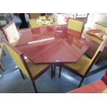 A Pierre Vandel of Paris lacquer dining table with octagonal glass top and four matching dining