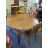 An early 20th century walnut extending dining table on cabriole legs with two extra leaves 29 1/2"