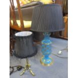 A mid 20th century American blue and gilt glass table lamp and a mid 20th century brass table lamp