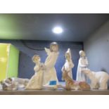 Four Lladro figures and three Lladro models of animals to include a polar bear and a bulldog